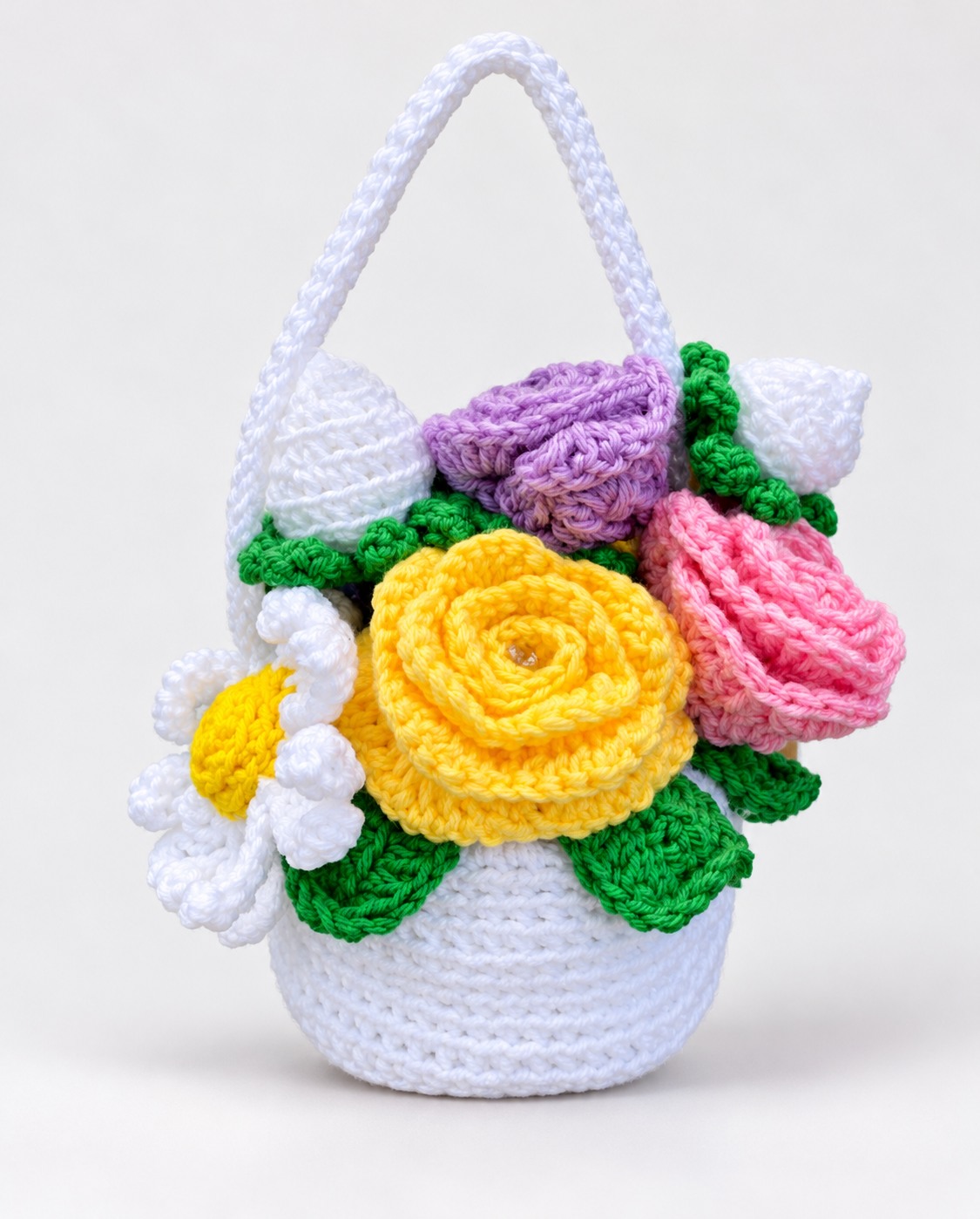 White crochet basket with yellow, pink and lavender flowers