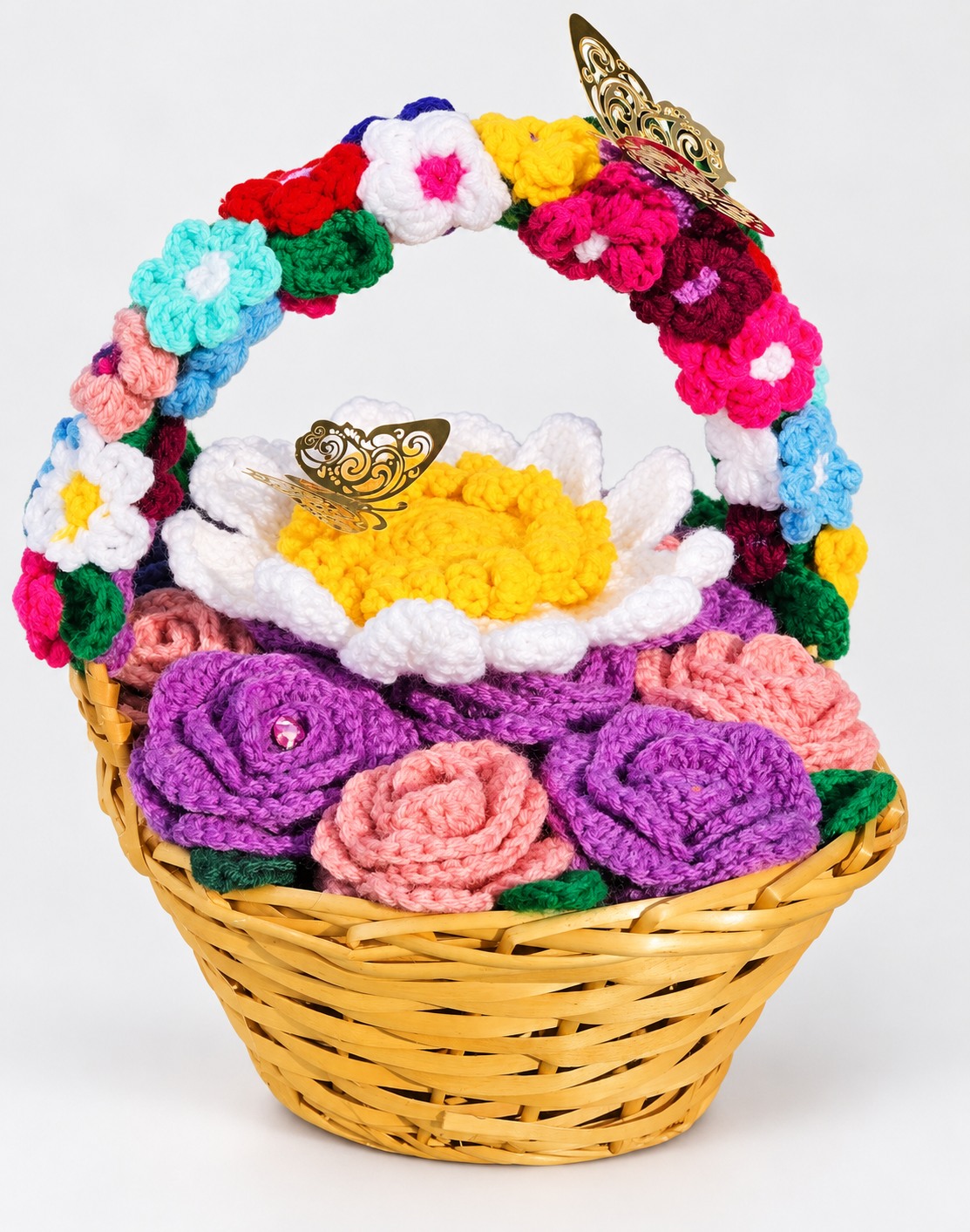 Yellow woven basket with crochet roses, daisy and flower-covered handle