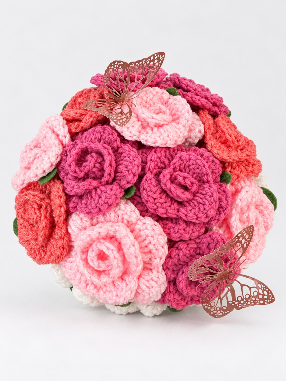 Pink and coral crochet flower bouquet with butterflies