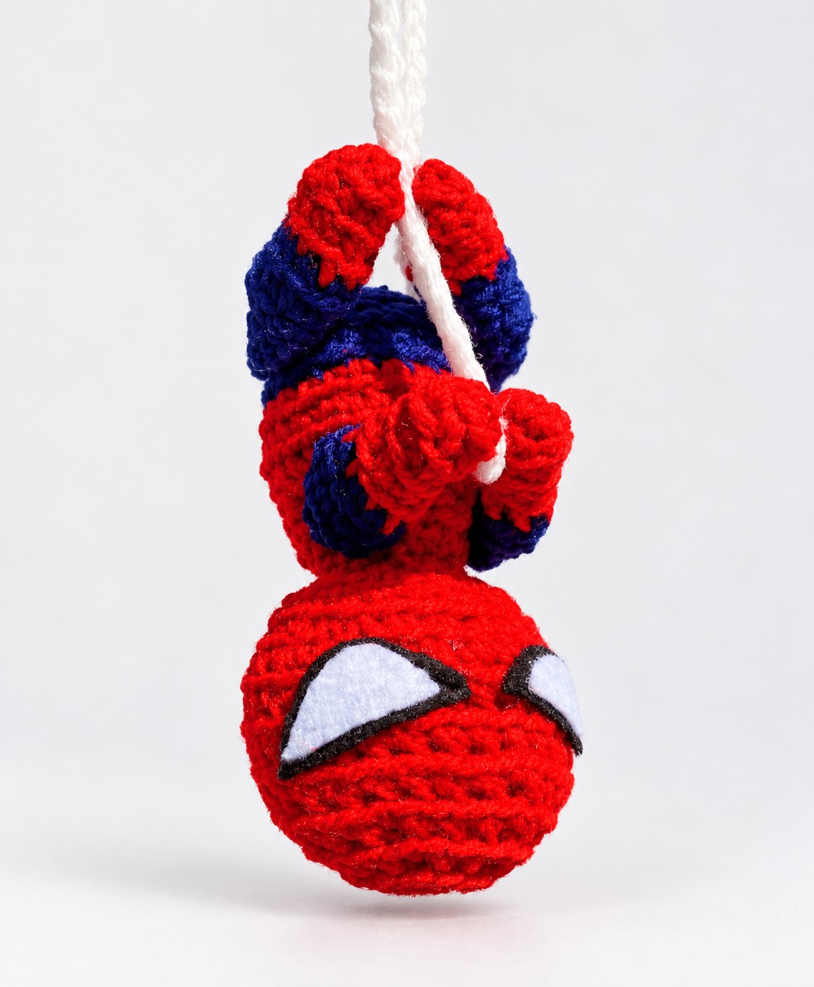 Red and blue spider crochet car mirror hanger