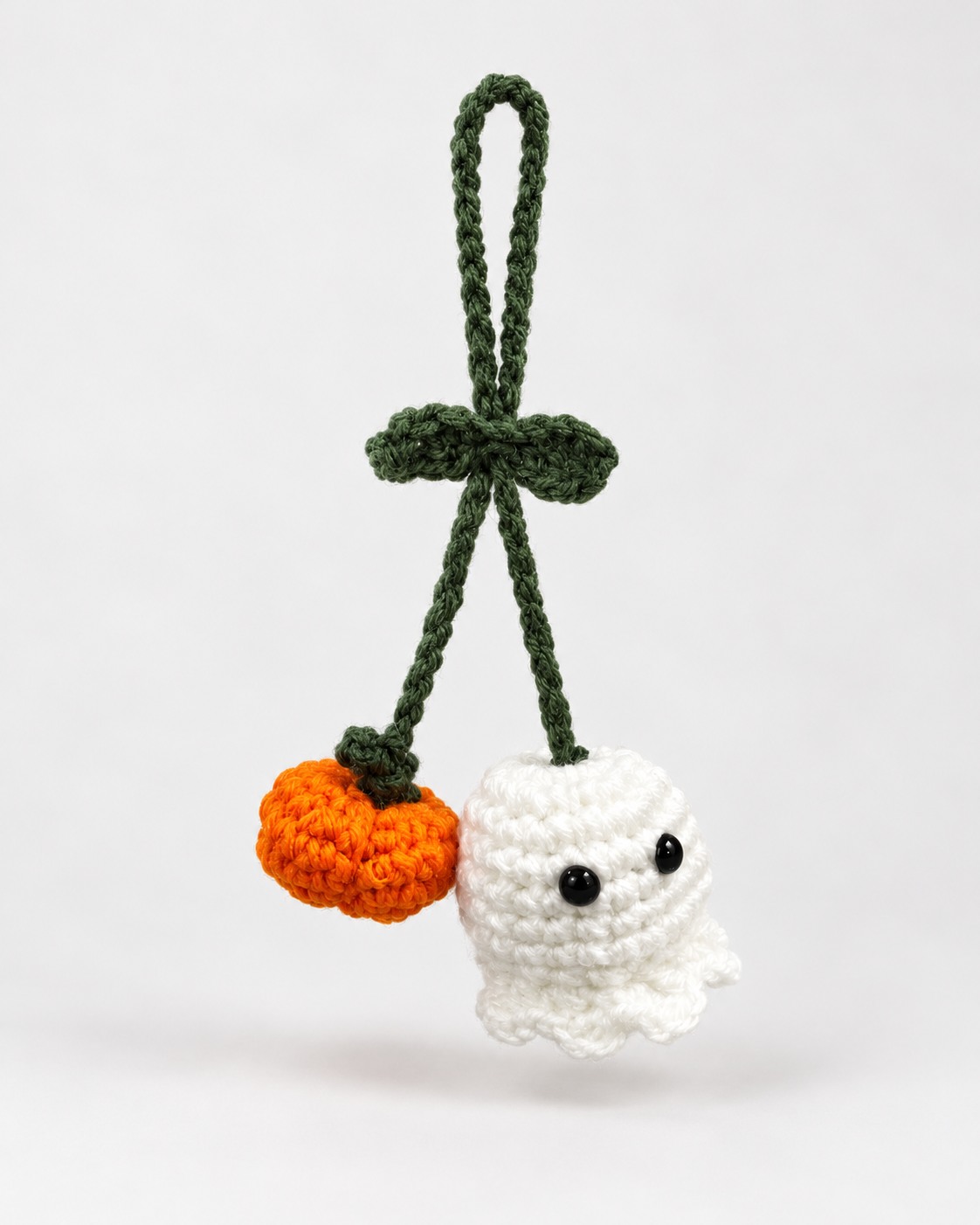 Small spooky crochet ghost and pumpkin car mirror hanger