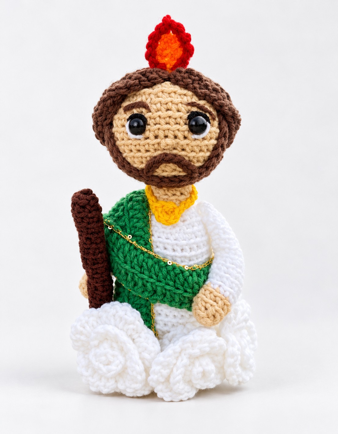 Religious flame character crochet plushie with green sash and staff