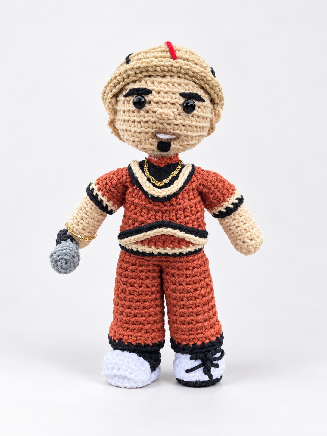 Orange and black crochet character plushie